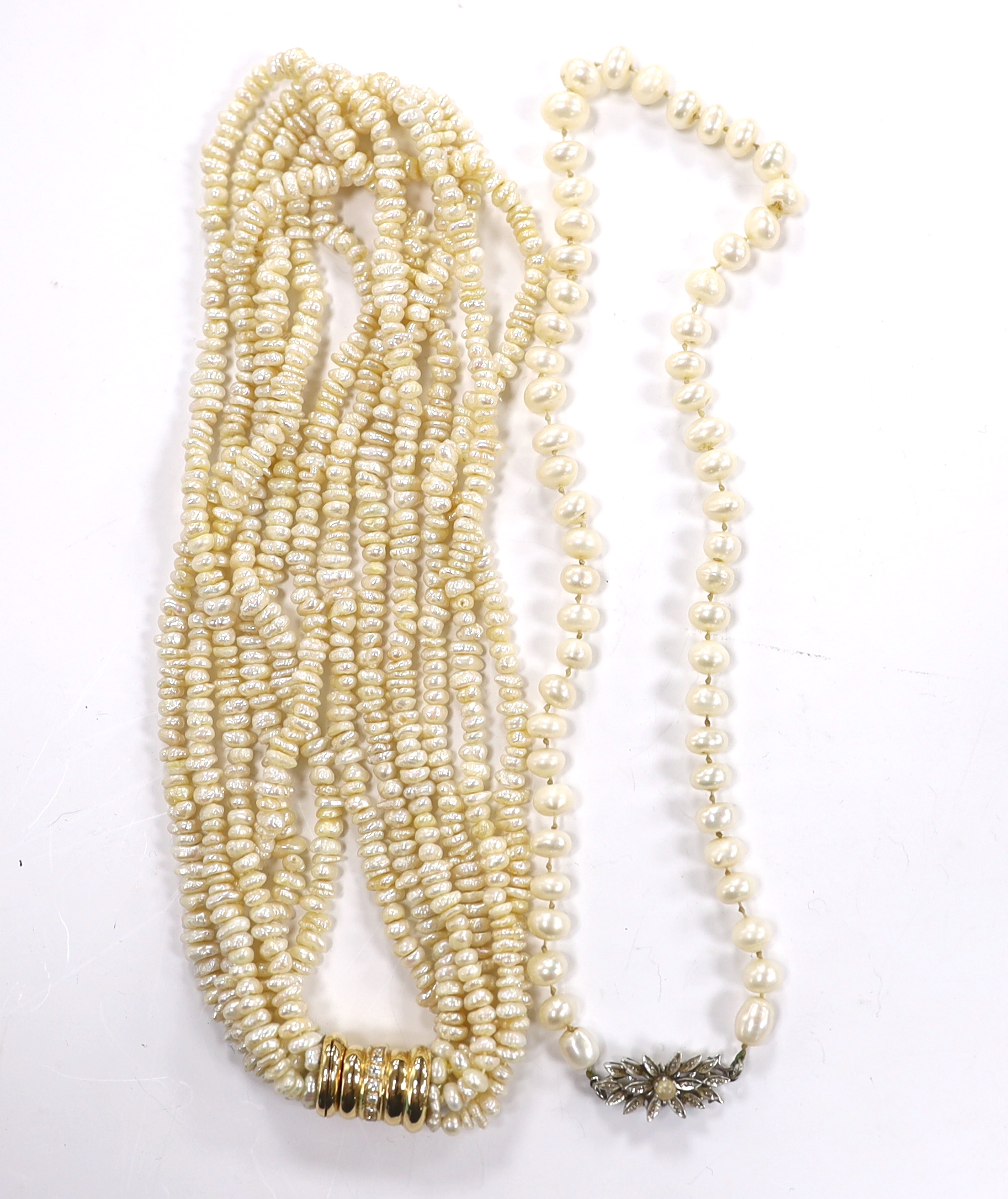 A modern multi strand freshwater? pearl choker necklace, with diamond set 585 barrel shaped clasp, 42cm and a single strand cultured pearl necklace with cultured pearl set 750 white metal clasp.
